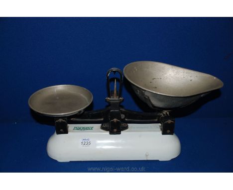 A small enamel and cast iron Weighing Scales