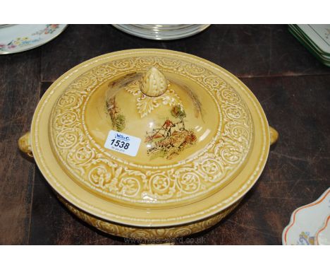 A Crown Devon lidded, footed Tureen in honey glaze with a Hunting scene.