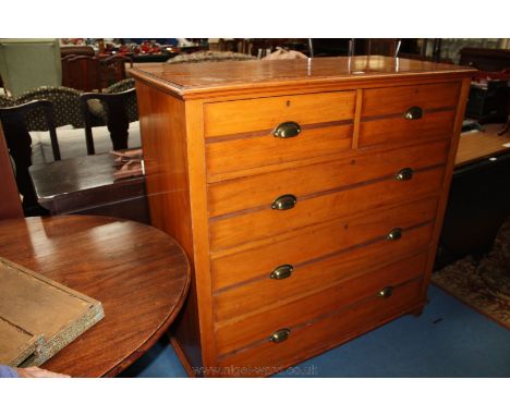 An Edwardian Satinwood Chest of two short over three long graduated Drawers having rectangular moulded edge top, over the fiv