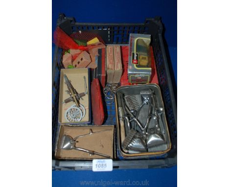 A box of miscellanea including a boxed Mercedes Benz 300SL, travelling chess set, hair clippers, small boxed British 6'' mort