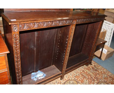 A late 19th c. Oak Open Bookcase having moulded rectangular top over curved frame front, in two sections with two adjustable 