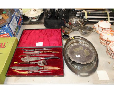 A silver mounted carving set together with a quantity of other silver plated ware to include a Harrods teapot etc.&nbsp;This 