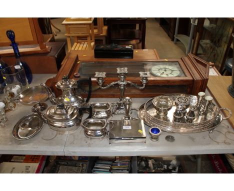 A collection of various silver plated ware to include candelabra, teapots etc.