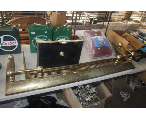 An extending brass fire fender, a Pierced brass fender and a brass and iron fender