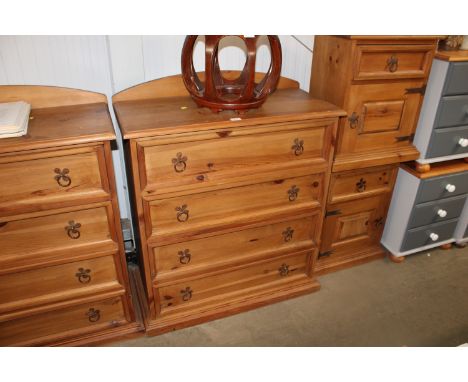 A pine chest fitted four long drawers having tile decoration 