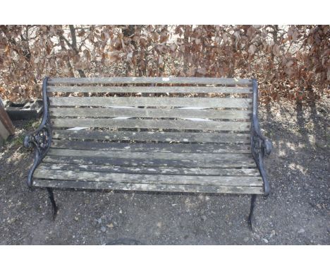 A wooden and cast iron garden bench