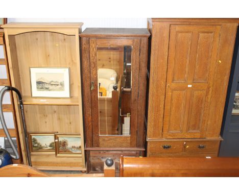 An oak mirrored door wardrobe