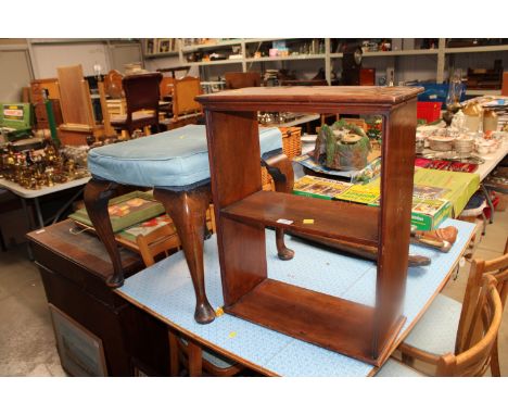 A mahogany upholstered stool raised on cabriole supports together with a wall hanging shelf