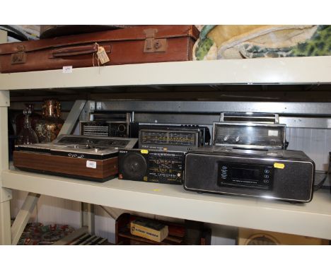 A TEAC docking station; a Sony stereo cassette recorder and five radios