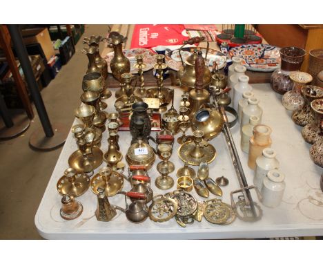 A collection of various brass ware to include vases, bells, teapot and postal scales, together with a quantity of various sto