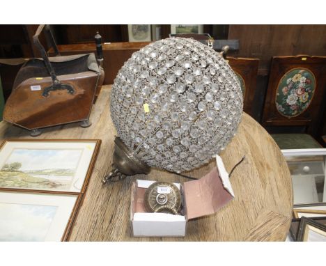A brass and glass ceiling light fitting 