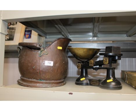 A copper coal scuttle together with a set of scales