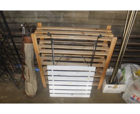 A metal framed folding table and a shelf unit