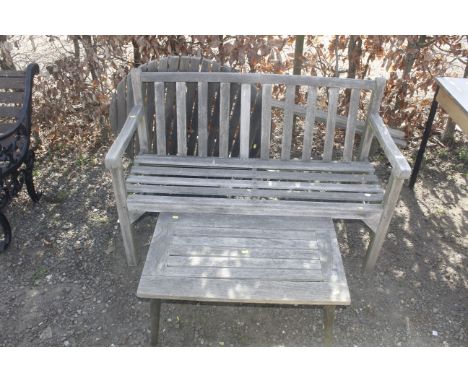 A hardwood garden bench, folding table and one other table 