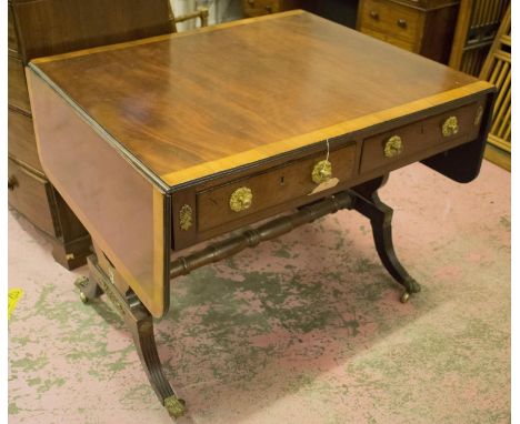 SOFA TABLE, Regency mahogany with crossbanded and inlaid detail with two pairs of opposing drawers with gilt handles, on cast