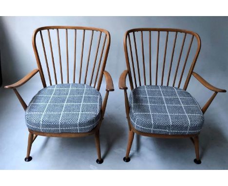 ERCOL ARMCHAIRS, a pair, beechwood with cushion seats (newly upholstered) and arched stick backs, 73cm W. (2) 