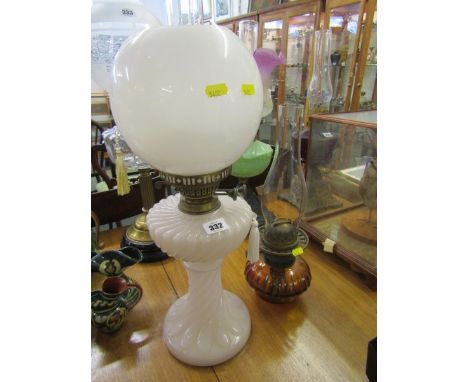 OIL LAMPS, milk glass moulded base oil lamp with spherical shade together with amber glass reservoir bracket lamp
