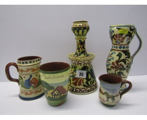 TORQUAY POTTERY, a conical base "Persian" style candlestick, "Arabesque" narrow bodied ewer jug and 3 other pieces 