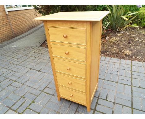 A good modern light wood chest of five graduated drawers retailed by Marks & Spencer, ca July 2012, 120 cm x 66 cm x 50 cm (s