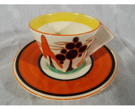 A Clarice Cliff Art Deco cup and saucer in the Red Roofs pattern Est £100 - £150