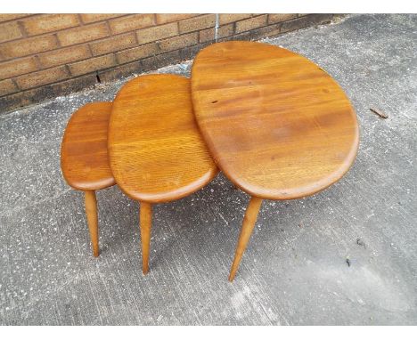 An Ercol nest of three tables in elm and beech designed by Lucian R Erolani - Est £80 - £120