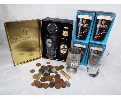 A collection of Guinness memorabilia to include four pint glasses with original boxes, a limited edition Guinness Original bo