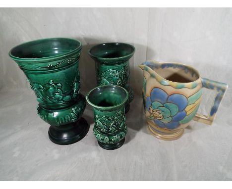 Four Sylvac graduated vases, # 4554, 4608, 4638 and 4784, and a water jug by Carlton Ware, 18.5 cm (h) - (4)