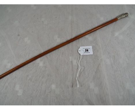 A swagger stick with regimental crest Royal Engineers