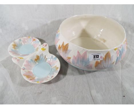 A Clarice Cliff pedestal bowl decorated with leaves and berries and a trinket dish of a similar pattern, Royal Staffordshire 