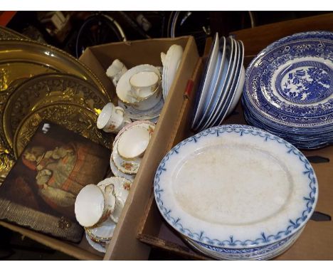 Two boxes containing a good mixed lot to include ceramic tableware, a quantity of brass plaques and other (2)