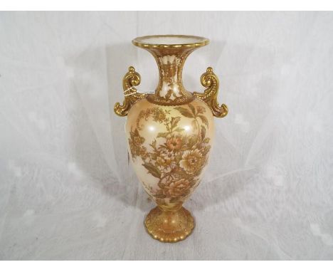 A Wiltshaw & Robinson Carlton Ware twin handled vase decorated in the Peony pattern, with gilt highlights on a blush ivory gr