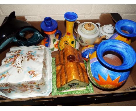 Two boxes to include a Beswick pottery cottage, Poole Pottery dolphin, Gran Canaria pottery, cheese dish and similar (2)