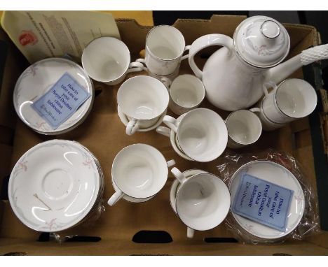 A Royal Doulton part tea / coffee service decorated in the Carnation pattern, H5084 comprising approximately 30 pieces
