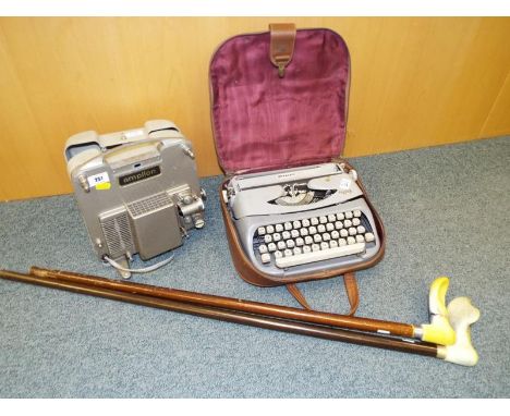 An Amplinon projector, a Royalite typewriter and two walking sticks (qty)