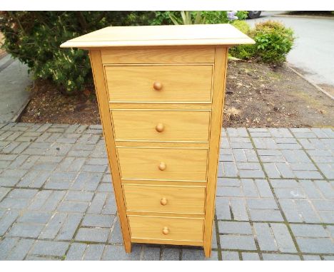 A good modern light wood chest of five graduated drawers retailed by Marks & Spencer, ca July 2012, 120 cm x 66 cm x 50 cm (s
