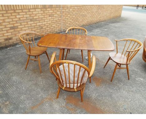 An Ercol light elm drop-leaf dining table, elm top, beech body and four Ercol dining chairs - Est £100 - £140