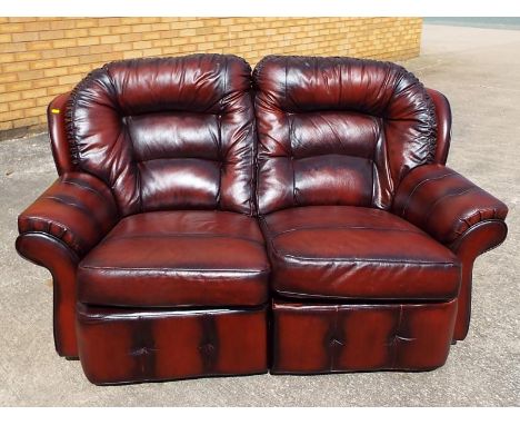 A good quality two-seater reclining leather sofa 