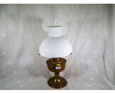 An Aladdin No. 23 brass oil lamp with funnel and shade, approximately 60cm (h)