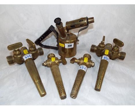 A brass blow lamp and four brass taps (5)