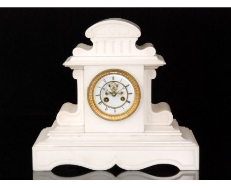 A late 19th Century white marble mantle clock of classical form the circular dial with anchor escapement enclosed by a glazed