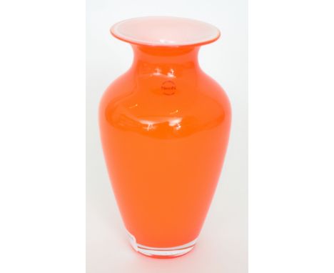 A contemporary Italian Murano glass vase of shouldered ovoid form with flared collar neck, cased in deep orange over opal, ac