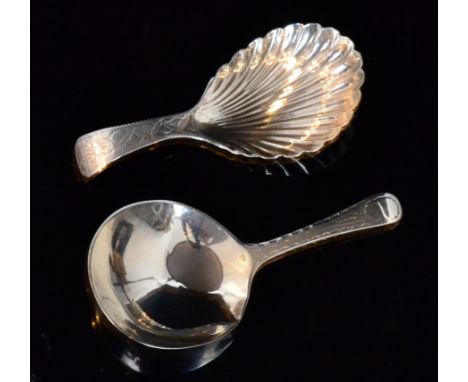 A George IV hallmarked silver caddy spoon with bright cut foliate decorated spade bowl below plain handle Birmingham 1824, Le
