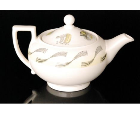 An Eric Ravilious for Wedgwood Garden pattern tea for one teapot, the cover decorated with a gardener picking fruit, a wheelb