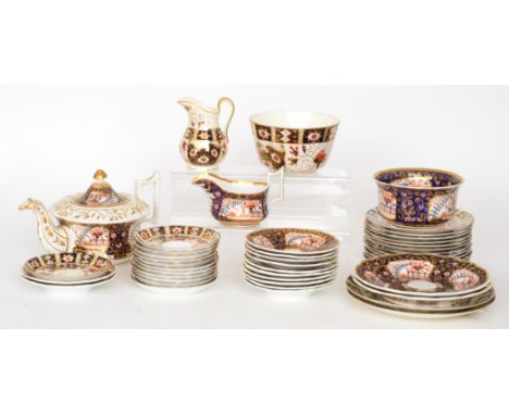 A large collection of Victorian Imari pattern teawares to include a large teapot, slop bowls, teacups and saucers, side plate