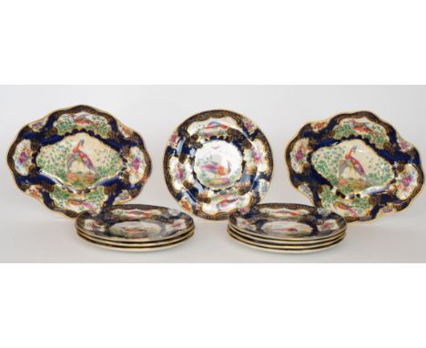 *Revision to printed estimate* An early 20th Century Booths 'Scale Blue' dessert service decorated with cartouche panels of e