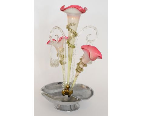 A late 19th Century Continental glass table centre epergne with a cast metal base rising to a shallow frill rim bowl with ena