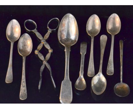 A small parcel lot of hallmarked silver spoons to include a George III fiddle pattern tablespoon, a Victorian spoon and fork 