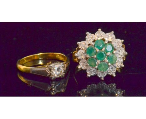 A 9ct emerald and diamond cluster ring, seven brilliant cut emeralds within a border of twelve illusion set diamonds to plain