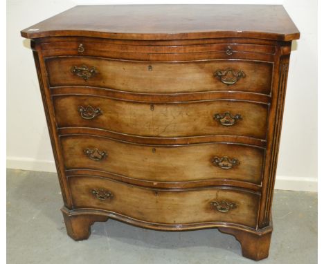 A 20th Century George III style mahogany serpentine chest of four long graduated drawers below a brushing slide on bracket fe