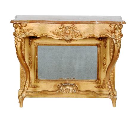 A 19th Century gilt console table with figured serpentine shaped top over a scroll frieze above a mirrored back on slender ca